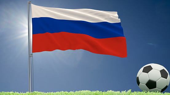 Flag of Russia fluttering and a football rolls on the lawn, 3d rendering
