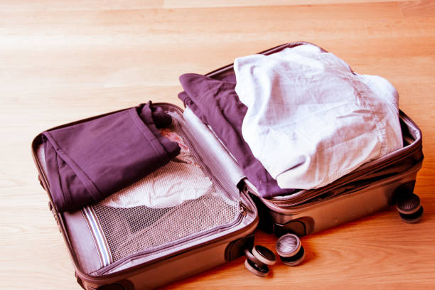 istock Suitcase being packed for a business casual or vacation trip 16 953440352