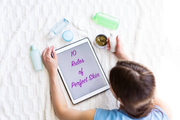 istock Woman reading an article about skincare 953442082