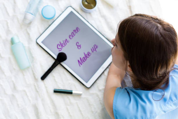 istock Woman reading an article about skincare 953442120