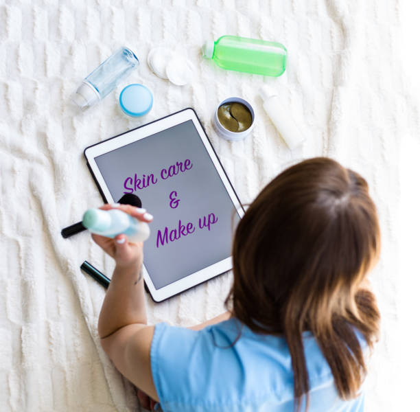 istock Woman reading an article about skincare 953442134