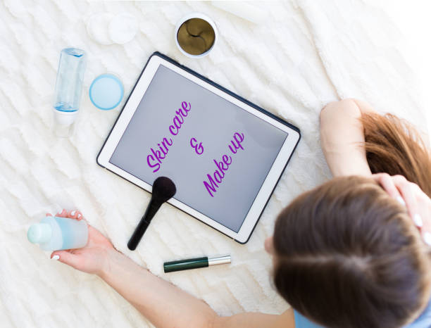 istock Woman reading an article about skincare 953442264