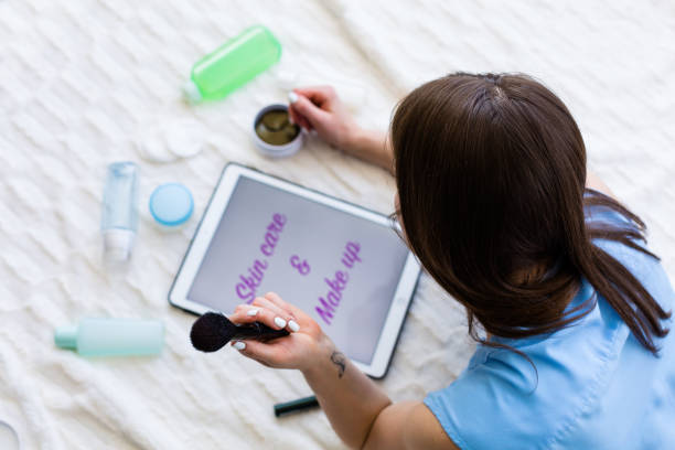 istock Woman reading an article about skincare 953442288