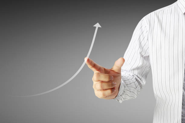 istock Businessman with financial symbols coming 953443436