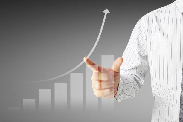 istock Businessman with financial symbols coming 953443754
