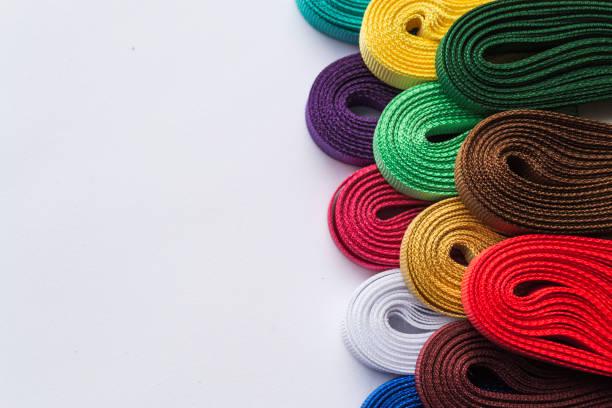 istock Various colored ribbons on white background. Closeup photo. Top view 953445274