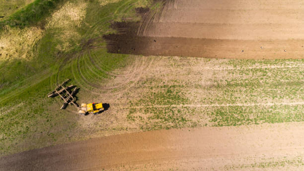 istock Aerial view of a tractor on a field. 953446206