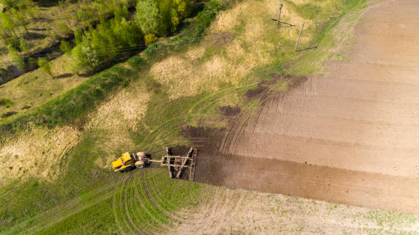 istock Aerial view of a tractor on a field. 953446212