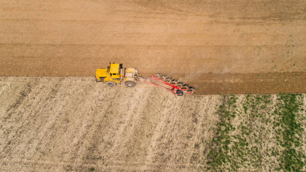istock Aerial view of a tractor on a field. 953446258