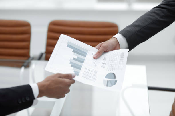 istock Business people discussing financial graphs 953446314