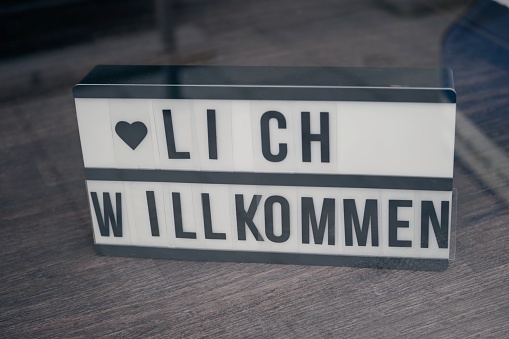 German sign saying Herzlich Wilkommen, meaning 'Welcome'