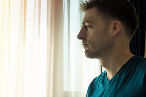 istock Young handsome man hoping for a brighter future and thinking about the past. 953448004