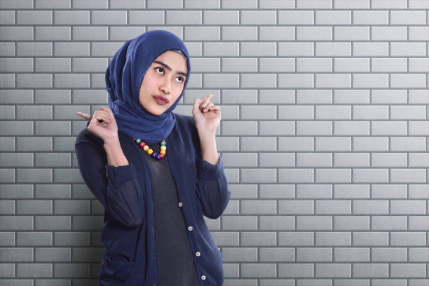 istock Happy asian muslim woman with funny expression 953454658