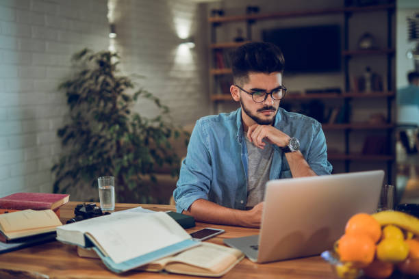 istock Young male student studying for the exams at home 953462216