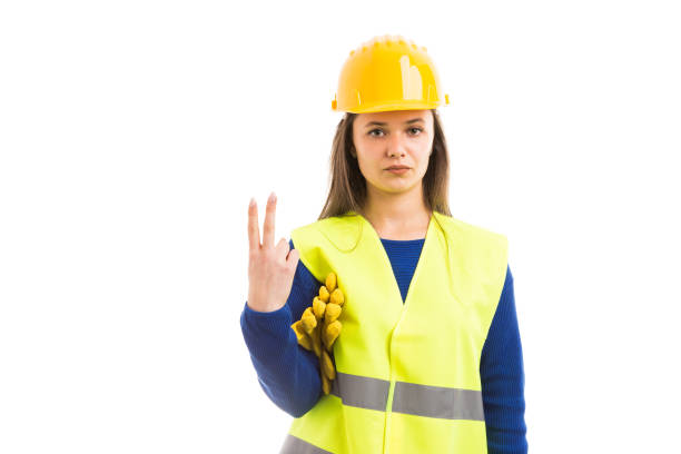 istock Young female architect showing number two 953462318