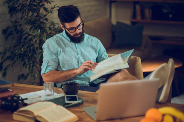 istock Young male student studying for the exams at home 953462770