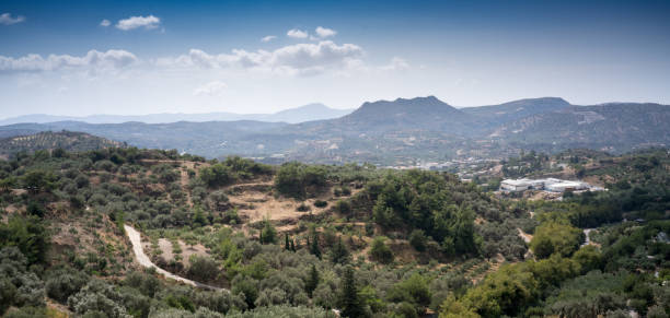 istock Field and mountain against cloudy sky 953464752