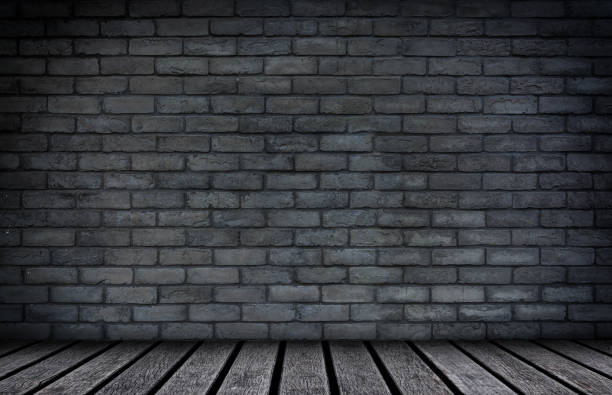 istock Wood floor with brick wall background 953465796