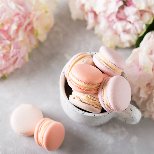 istock Spring mood still life with macaroons in cup and flowers 953466190