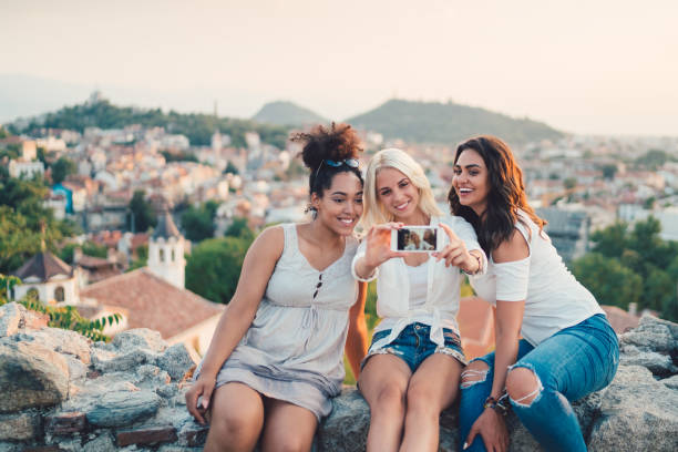 istock Women on trip in Europe taking selfies 953466378