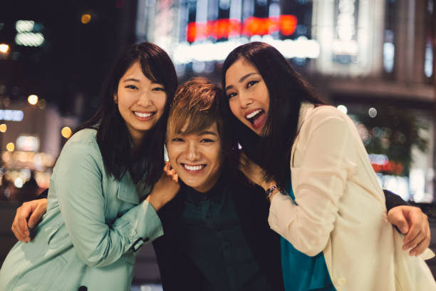 istock Joyful japanese friends in Osaka by night 953466620