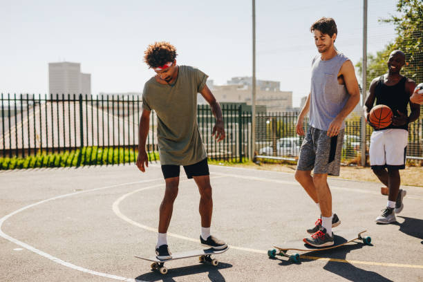 istock Basketball players skating on skateboard 953467018