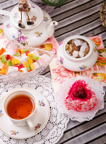 istock Porcelain cup of tea with lemon and sweets 953467818