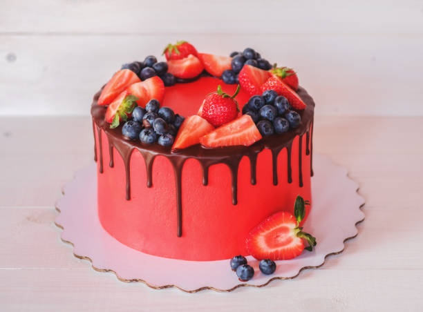 istock beautiful home made red cake with strawberries and blueberries 953468186