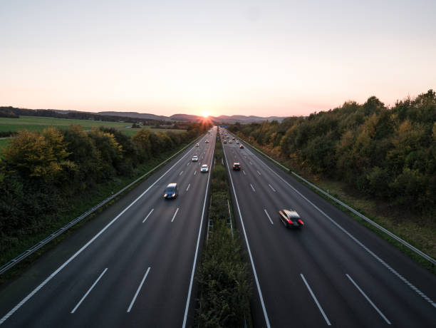istock The road traffic on a motorway at sunset 953471108