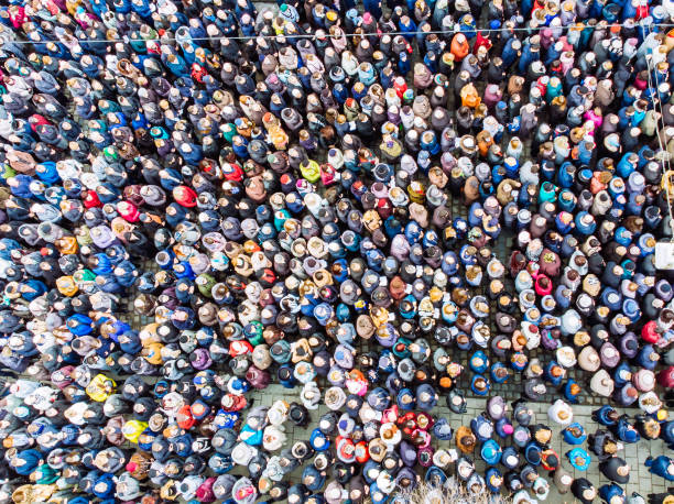 istock above view on crowd. big amount of people. 953473086