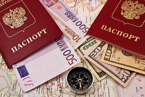 istock Passport  with the money on a map and compass 95347659
