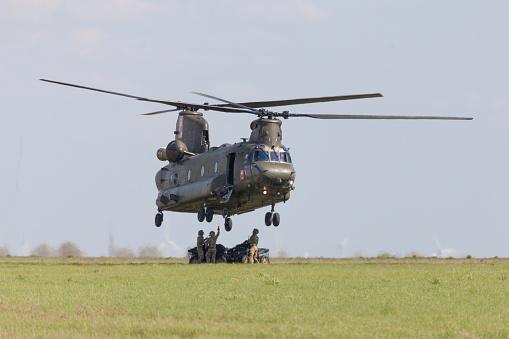 Berlin / Germany - April 28, 2018: Military transport helicopter Chinook from Boing Rotor Craft Systems flies at airport Berlin / Schoenefeld.
