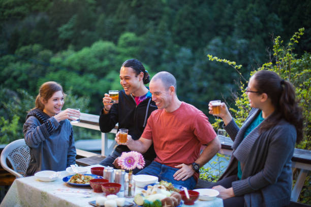istock Group of young adults having dinner outside on a patio 953477736