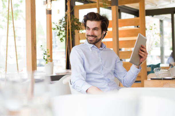 istock Young man listening favorite tune 953479982