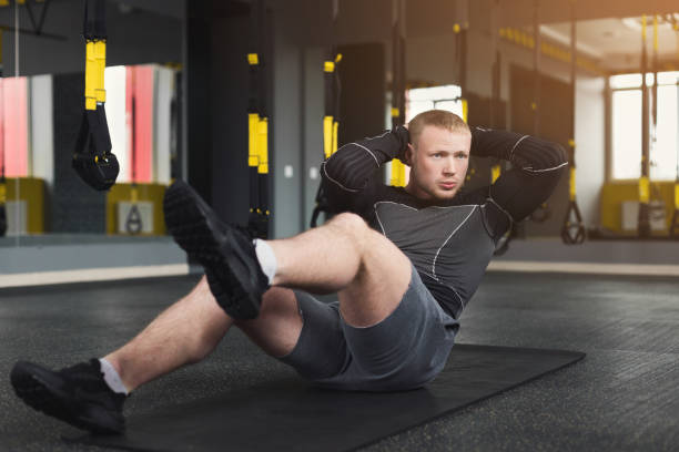 istock Young man fitness workout, sit-up crunches for abs 953481402