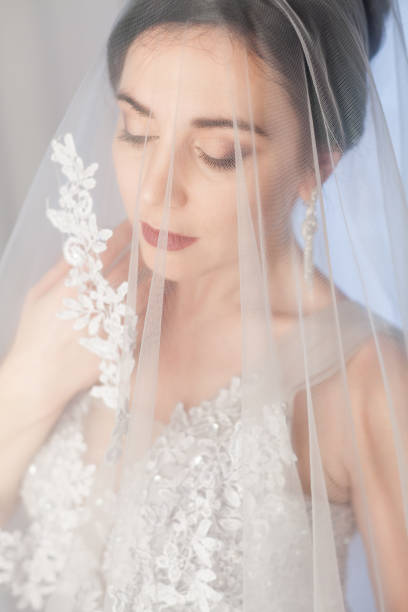 istock brunette woman in gray wedding gown 953482676