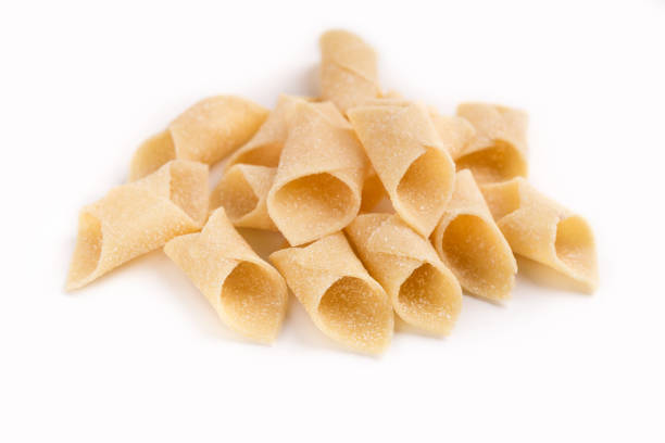 istock Heap of garganelli pasta isolated on white 953496660