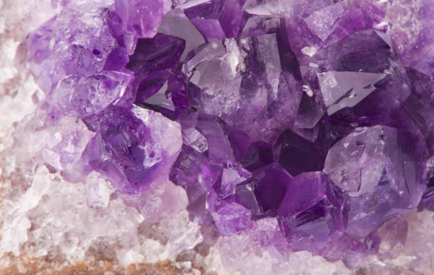 istock Macro structure of natural violet amethyst gem stone crystals texture 953498218