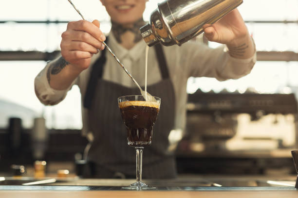 istock Happy barista making coffee cocktail at cafe counter 953501206