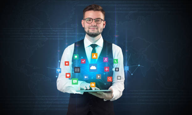 istock Young businessman with tablet and application 953508062