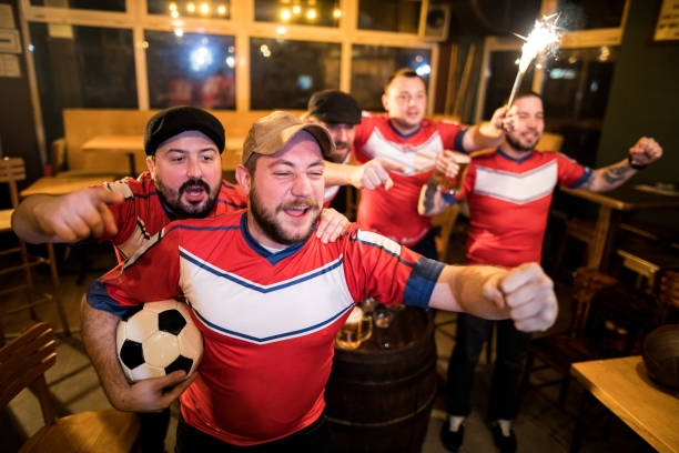 istock Men watching soccer game in a bar 953508136