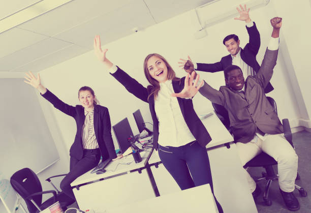 istock Group of business people celebrating victory 953508228
