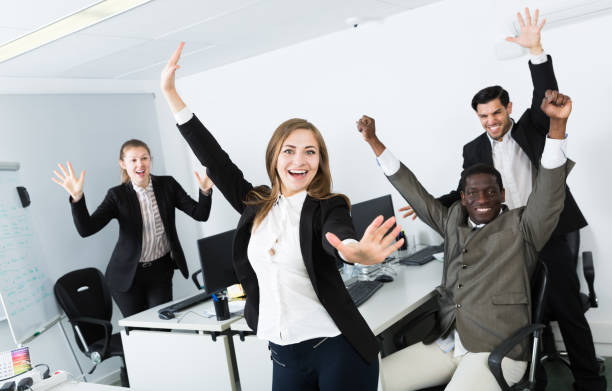 istock Group of business people celebrating victory 953508244