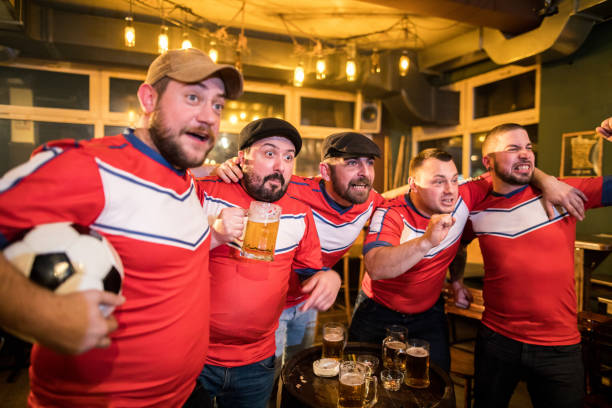 istock Friends watching a football match 953509142
