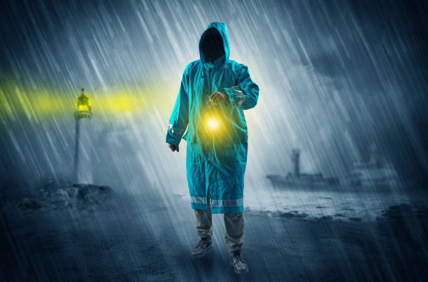 istock Man coming with lantern at coast concept 953510098