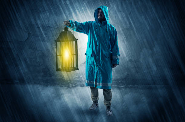 istock Wayfarer with lantern in front of crumbly wall 953510146