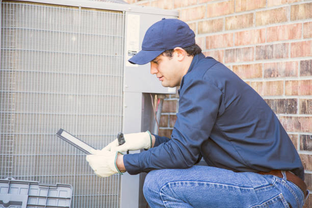 istock Blue collar air conditioner repairman at work. 953513932