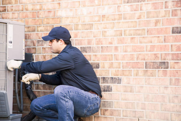 istock Blue collar air conditioner repairman at work. 953514474
