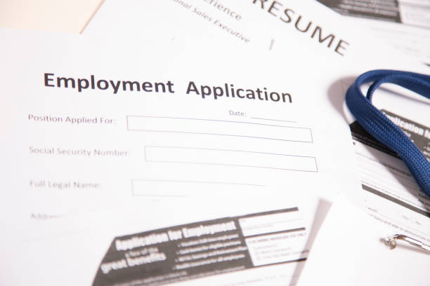 istock Job fair table with employment applications, resumes. 953516036