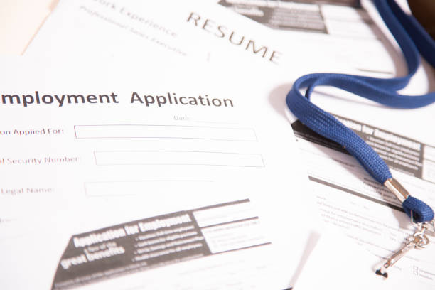 istock Job fair table with employment applications, resumes. 953516480